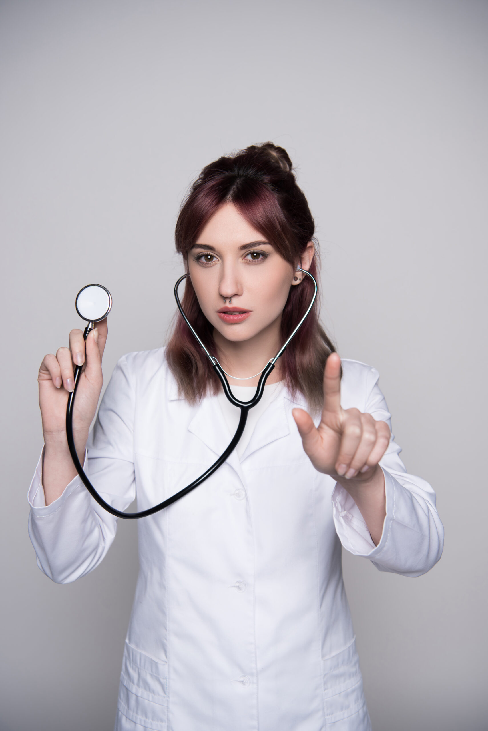 woman with doctor uniform and septum piercing